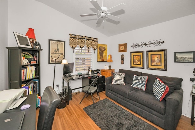 office featuring ceiling fan, vaulted ceiling, and wood finished floors