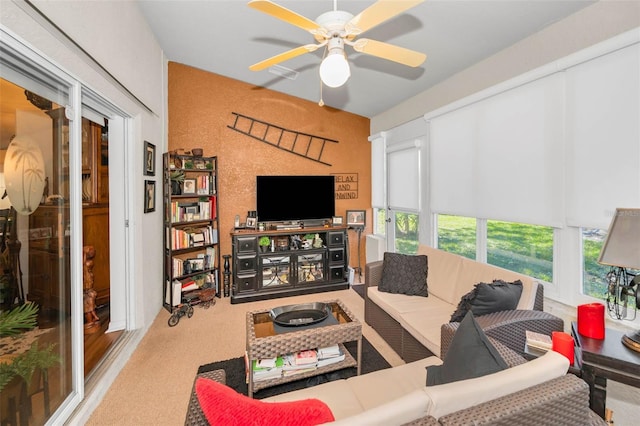 living area with a ceiling fan