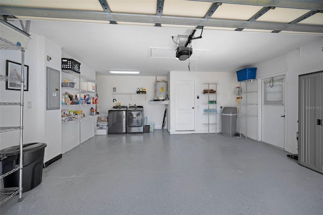 garage with water heater, washing machine and clothes dryer, electric panel, and a garage door opener