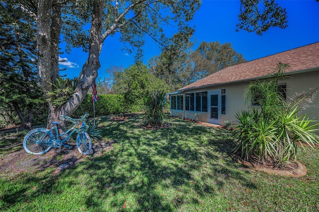 view of yard featuring a sunroom