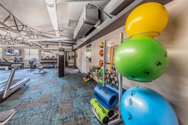 exercise room featuring carpet floors