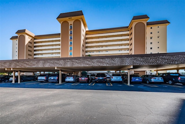 view of building exterior with covered parking