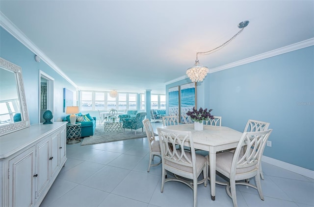 dining room featuring light tile patterned floors, ornamental molding, an inviting chandelier, and baseboards