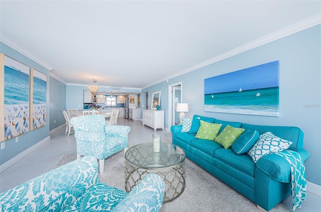 living area with ornamental molding, a notable chandelier, and baseboards