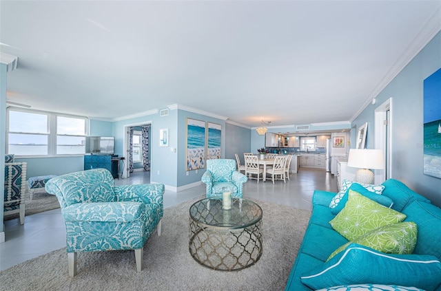 living area with visible vents, crown molding, and baseboards