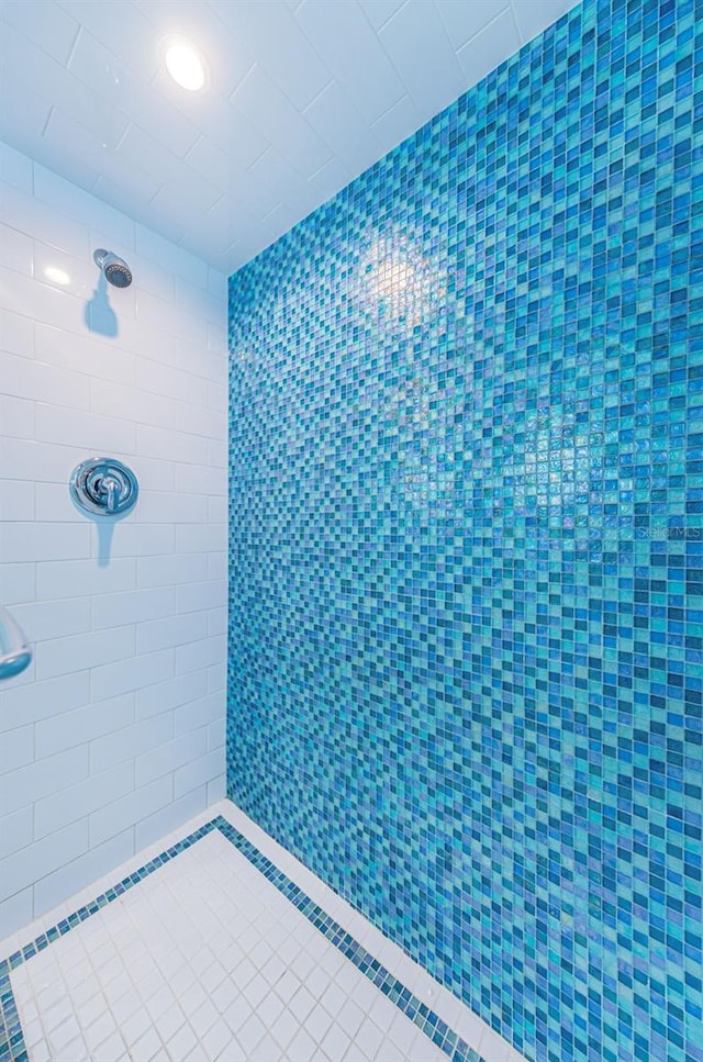 bathroom with tiled shower