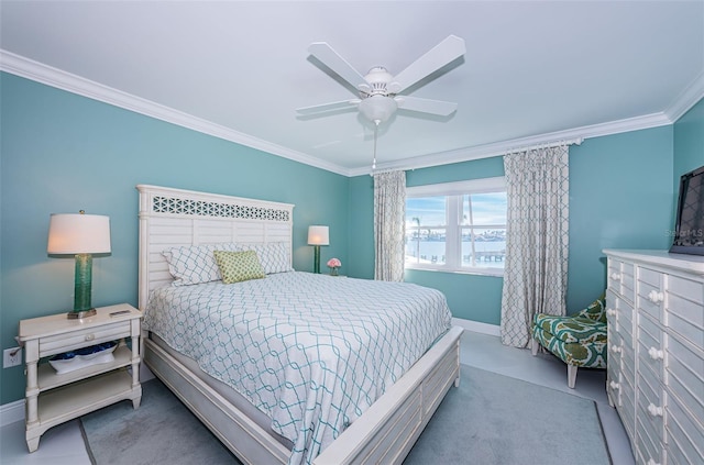 bedroom featuring ornamental molding, carpet flooring, baseboards, and a ceiling fan