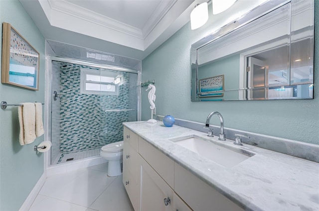 full bathroom featuring toilet, ornamental molding, a stall shower, vanity, and tile patterned floors