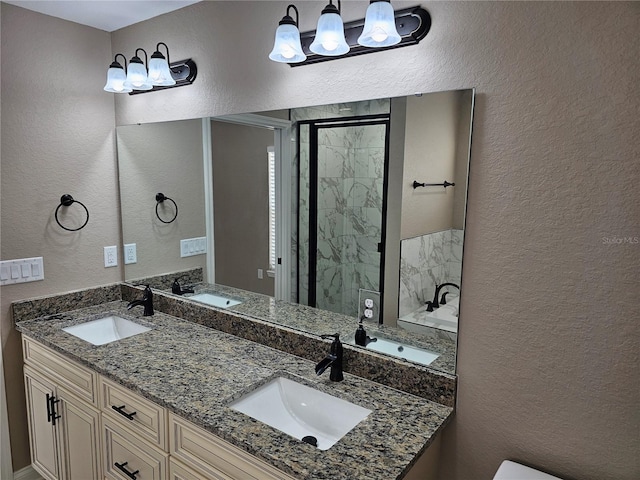 bathroom featuring vanity and an enclosed shower