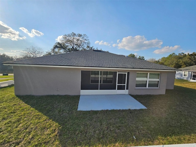 back of house featuring a patio and a yard