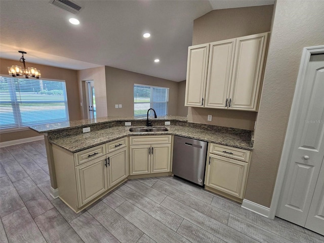 kitchen with cream cabinetry, sink, kitchen peninsula, and dishwasher