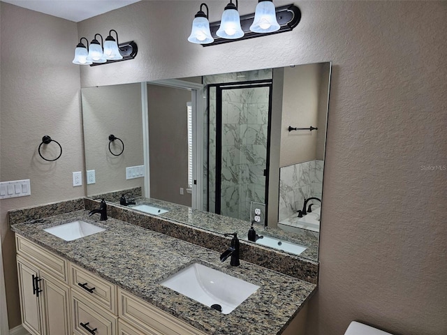 bathroom featuring vanity and a shower with shower door