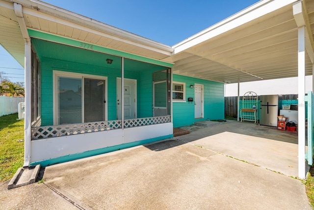 exterior space featuring a carport