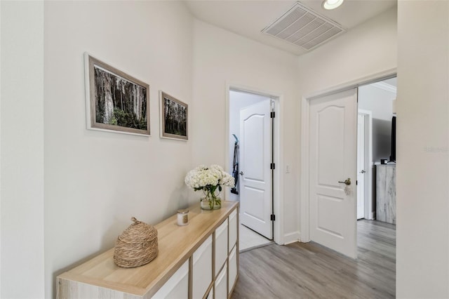 hall with light hardwood / wood-style floors