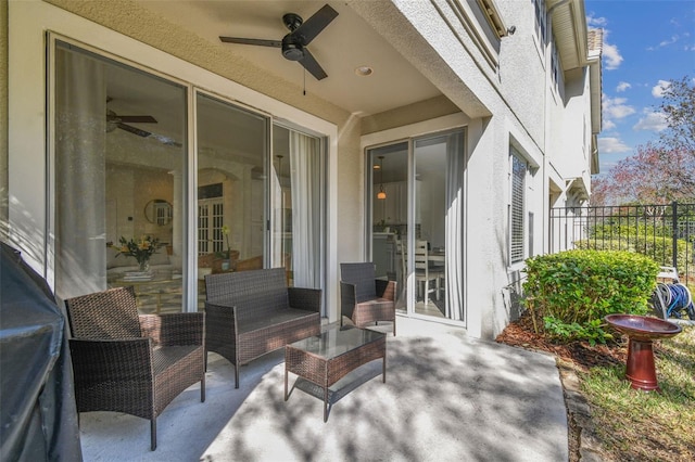 view of patio / terrace featuring ceiling fan