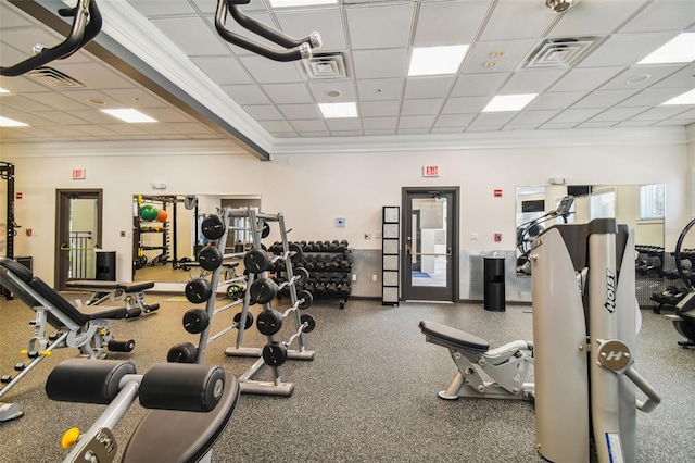 exercise room featuring a drop ceiling and crown molding