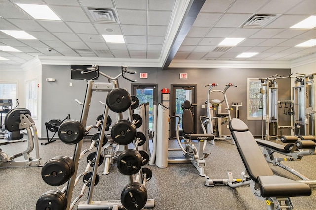 workout area with crown molding and a paneled ceiling