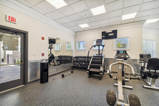 exercise room with crown molding and a paneled ceiling