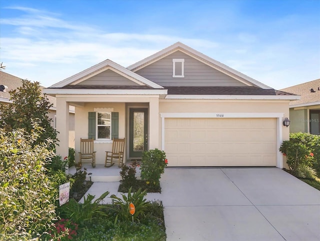 view of front of house featuring a garage and a porch