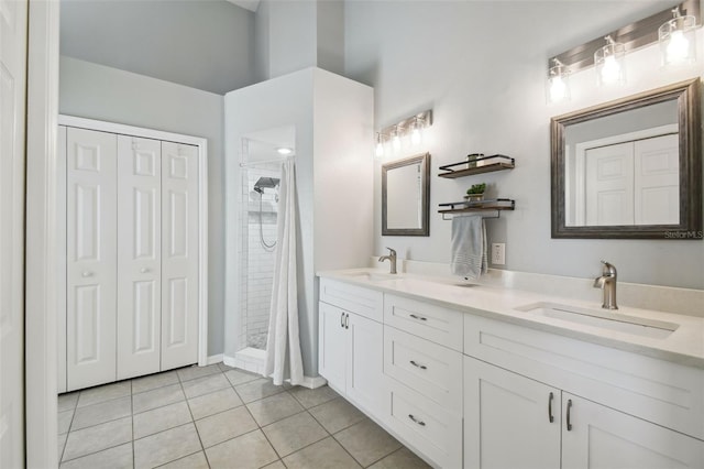 bathroom featuring vanity, tile patterned floors, and a shower with curtain