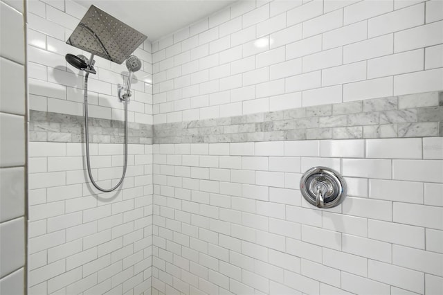 bathroom with a tile shower