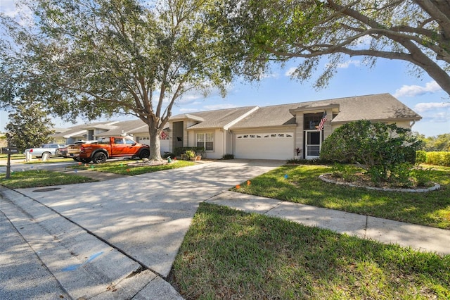 single story home with a garage and a front yard