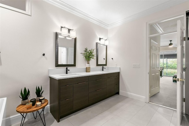 bathroom with tile patterned flooring, crown molding, and vanity