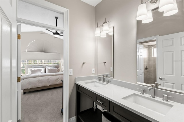 bathroom with vanity, a shower, and ceiling fan