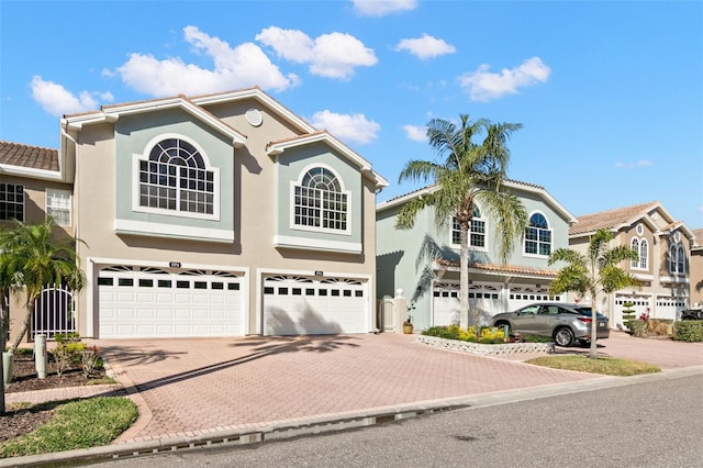 mediterranean / spanish home featuring a garage