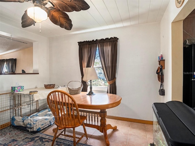 dining room with light tile patterned floors and ceiling fan