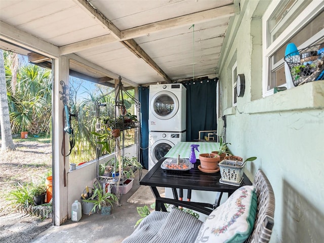 exterior space featuring stacked washer and dryer