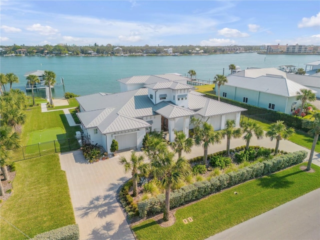 birds eye view of property with a water view