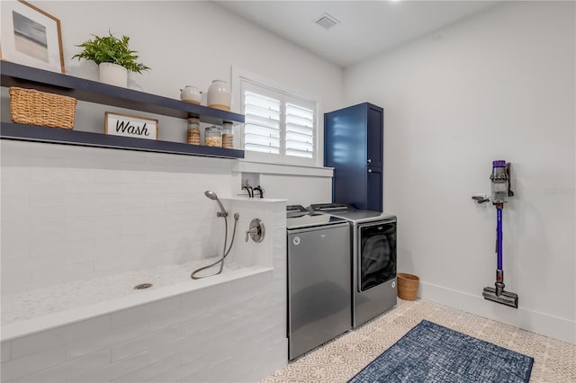 laundry room featuring washing machine and dryer