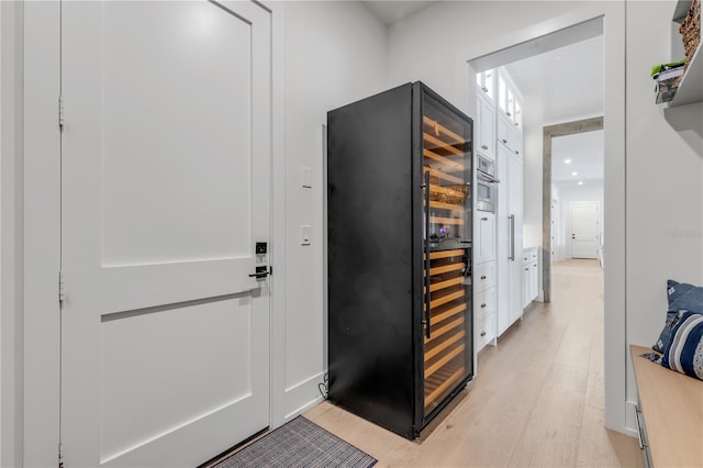 corridor with light hardwood / wood-style flooring