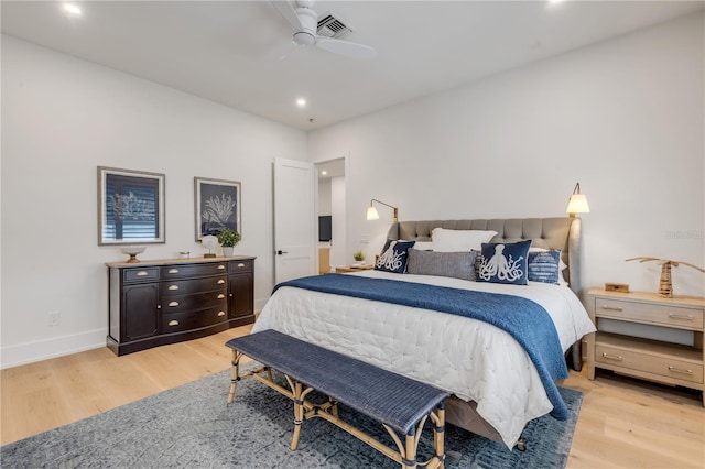 bedroom with ceiling fan and light wood-type flooring