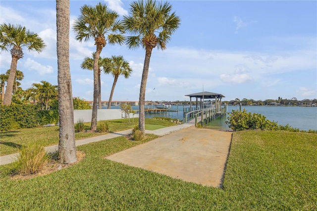 exterior space featuring a water view and a yard