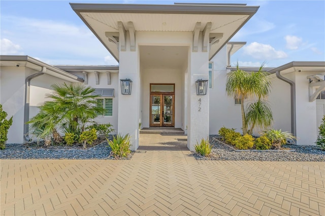 view of exterior entry featuring french doors