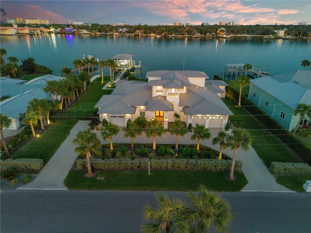 aerial view at dusk with a water view