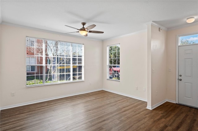 foyer featuring ceiling fan, baseboards, wood finished floors, and ornamental molding