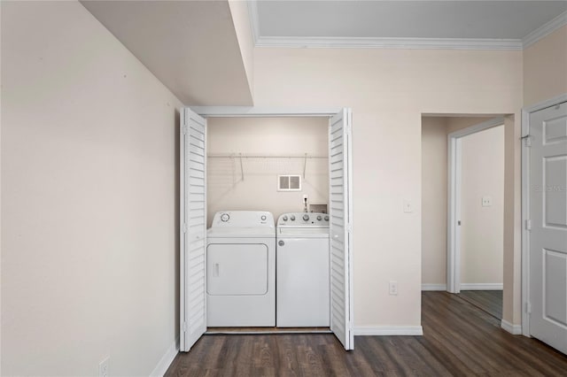 laundry area featuring visible vents, dark wood finished floors, laundry area, washer and dryer, and crown molding