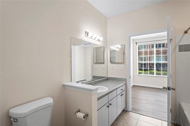 full bath featuring tile patterned floors, toilet, and vanity