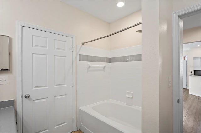 full bathroom featuring recessed lighting, shower / tub combination, and wood finished floors