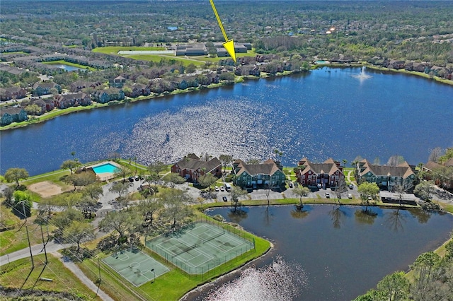 drone / aerial view with a residential view and a water view