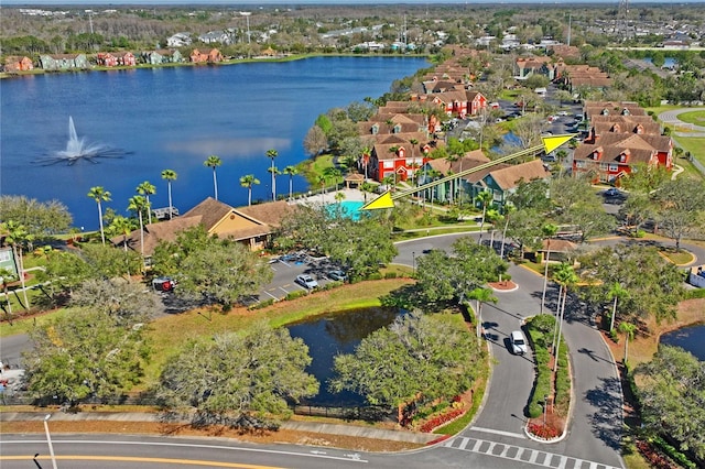 aerial view featuring a residential view and a water view