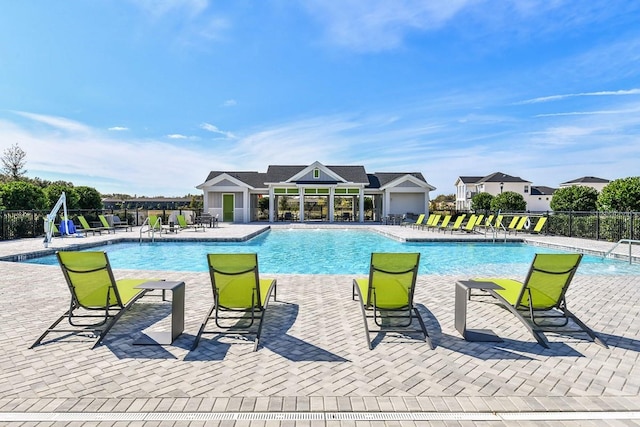 view of pool featuring pool water feature and a patio area