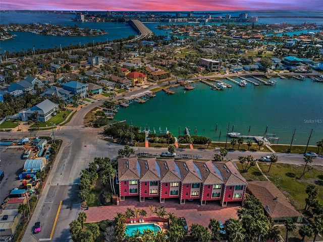 aerial view at dusk with a water view