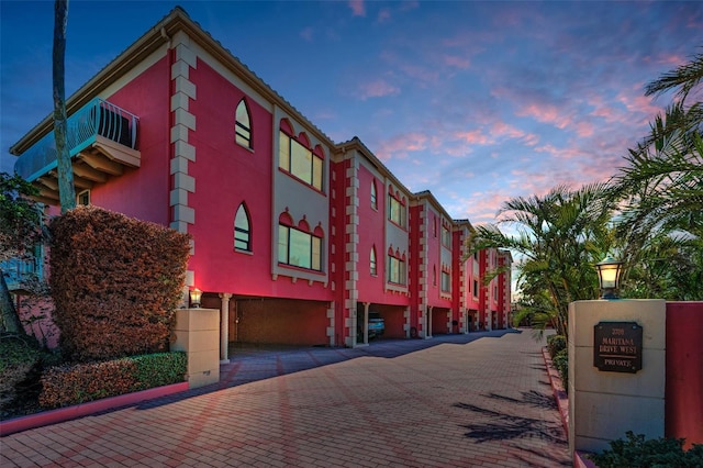 view of outdoor building at dusk