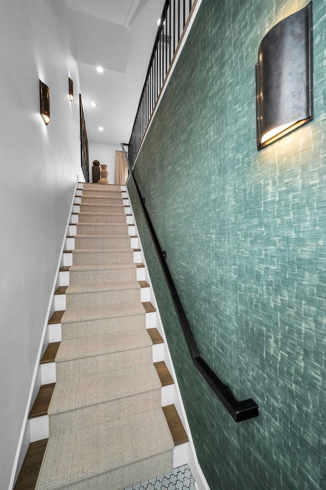 stairs featuring hardwood / wood-style flooring