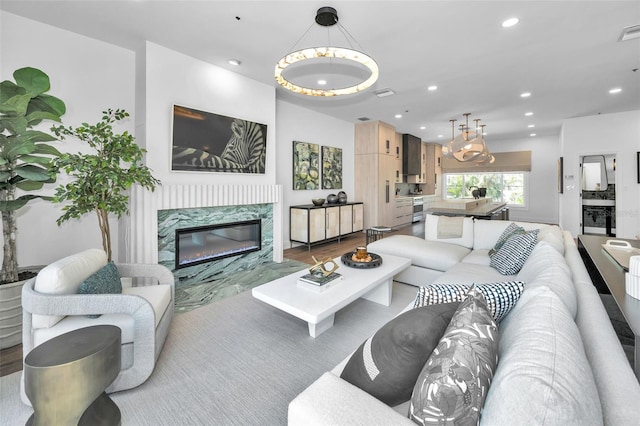 living room with hardwood / wood-style floors and a fireplace