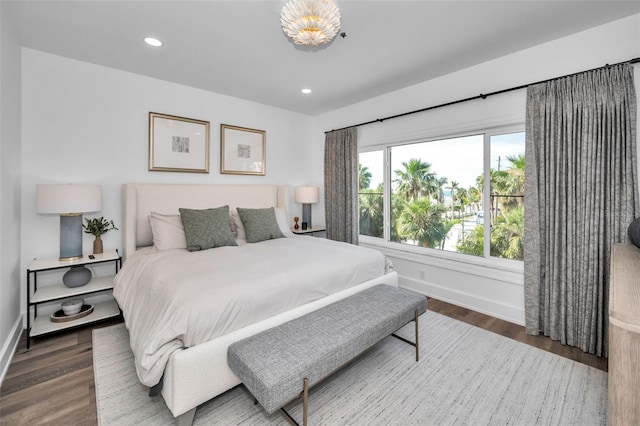 bedroom with dark wood-type flooring